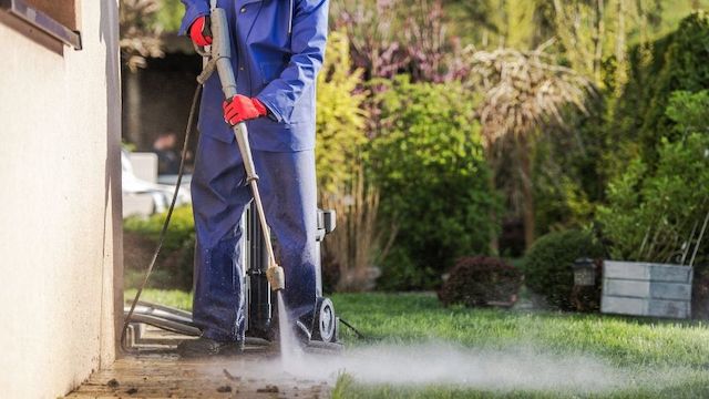 property-maintenance-person-blowing-leaves